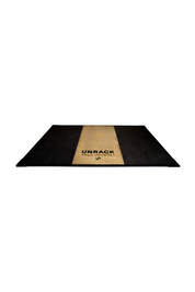 Black rubber tiles around a wood showcasing a weightlifting platform 